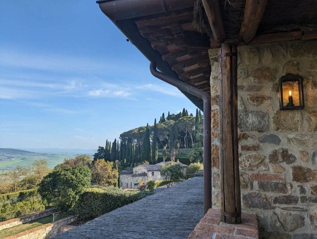 Tuscan hills and stone architecture at Rosewood Castiglion del Bosco.