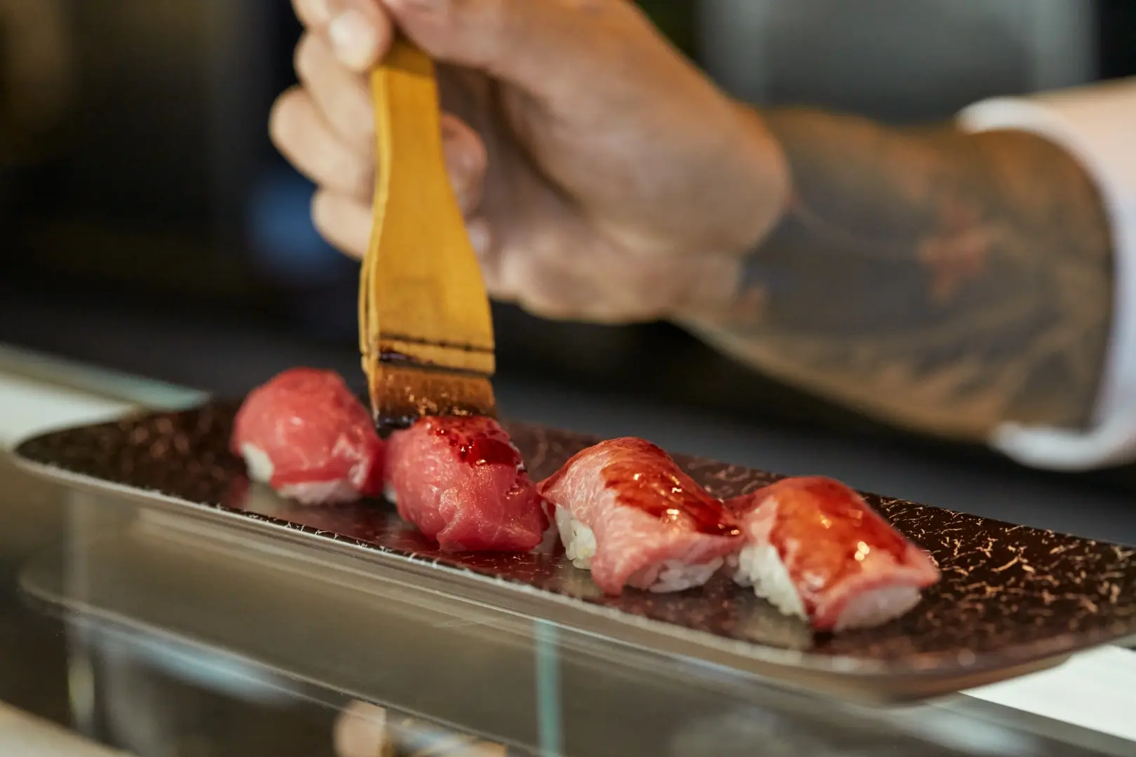 A chef preparing sushi aboard EXPLORA I